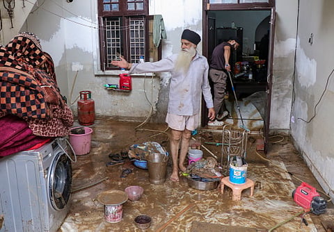 Flash floods inundated residential areas, damaged vehicles and triggered landslides, disrupting traffic across several parts of Jammu