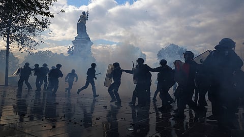 Police scuffle with protesters during a demonstration against rising living costs, joining students' grievances, in Paris | File image/PTI