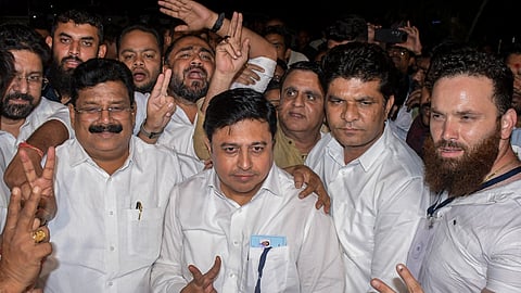 Samajwadi Party celebrated victories in Uttar Pradesh as Congress countered PM Modi's criticism over its poor performance