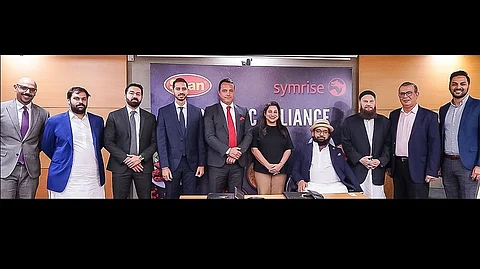 Signing of the cooperation agreement between Shan Foods Board (family) and Symrise representative Sofiane Berrahmoune, vice president, Africa and Middle East