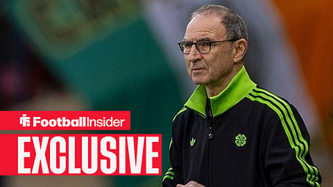 Martin O'Neill in a Celtic tracksuit on touchline looking at the pitch