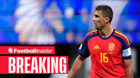 Rodri in action for Spain with captain's armband on looking to the left