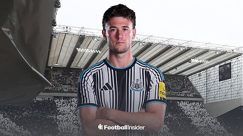 Parma defender Alessandro Circati in a 2026-27 Newcastle shirt with arms folded in front of wide shot of St James' Park's Sir John Hall stand