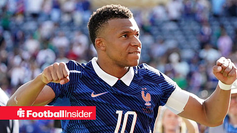 Kylian Mbappe raises both fists as he celebrates France's Word Cup win over Senegal