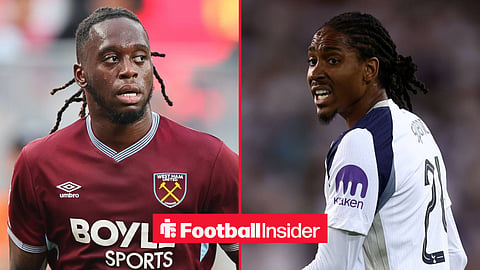 Aaron Wan-Bissaka playing for West Ham looking right with Djed Spence shouting towards him while playing for Tottenham