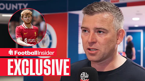 Steven Schumacher speaks to Bolton Wanderers media team / Luca Stephenson 91 during the Preston North End FC v Liverpool FC Pre-Season Friendly match at Deepdale, Preston, England, United Kingdom on 13 July 2025