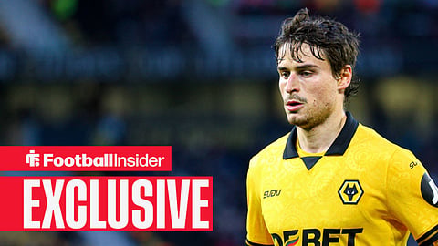 Hugo Bueno playing for Wolves in Old Gold kit