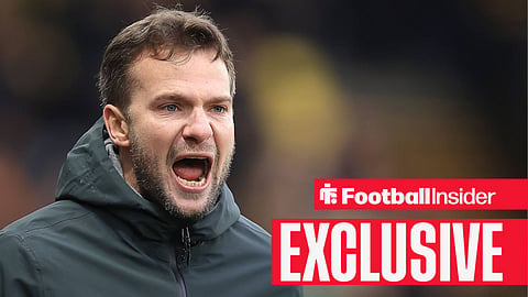 Tom Cleverley shouting with grey coat on