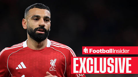 Mohamed Salah jogging in Liverpool home kit