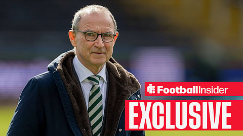 Martin O'Neill smiling in suit on pitch