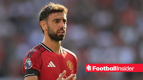 Bruno Fernandes with hand raised looking confused
