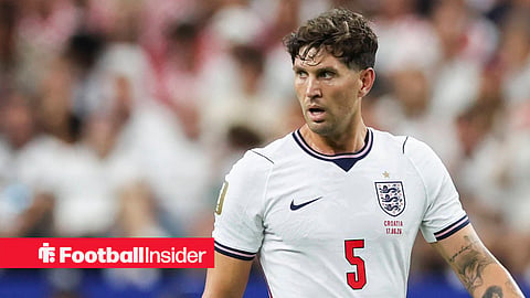 John Stones in action at the World Cup looking left