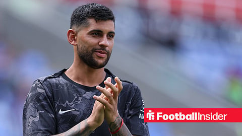 Cristian Romero clapping fans in warm-up