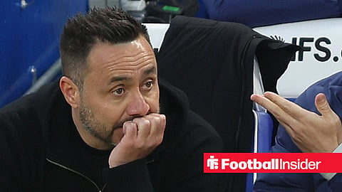 Roberto De Zerbi with his head in his hands in the Tottenham dugout