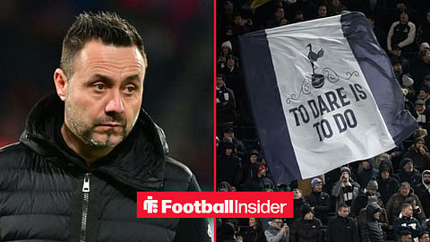 Roberto De Zerbi on the sidelines at Tottenham, with Spurs fans holding a banner