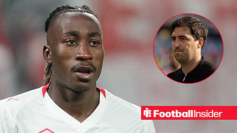Yan Diomande in action with Andoni Iraola walking on pitch right inset
