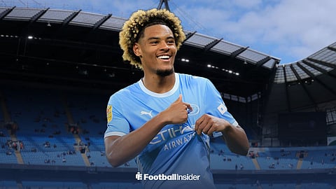 Floyd Samba celebrating in Man City home kit