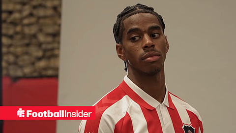 Dayann Methalie posing for picture after signing for Sunderland