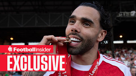 David Raya biting his PL winners' medal