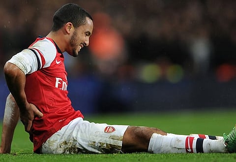 Red alert: Theo Walcott is one of 10 players who are sidelined through injury