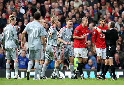 Football - Manchester United v Liverpool - Barclays Premier League - Old Trafford - 08/09 - 14/3/09
Manchester United's Nemanja Vidic is sent off by referee Alan Wiley as Cristiano Ronaldo (2nd R) looks on
Mandatory Credit: Action Images / Carl Recine
NO ONLINE/INTERNET USE WITHOUT A LICENCE FROM THE FOOTBALL DATA CO LTD. FOR LICENCE ENQUIRIES PLEASE TELEPHONE +44 (0) 207 864 9000.