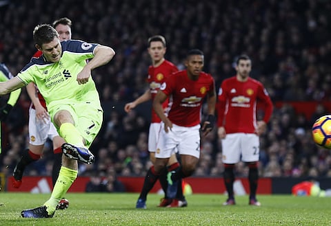 Britain Soccer Football - Manchester United v Liverpool - Premier League - Old Trafford - 15/1/17 Liverpool's James Milner scores their first goal from the penalty spot Action Images via Reuters / Jason Cairnduff Livepic EDITORIAL USE ONLY. No use with unauthorized audio, video, data, fixture lists, club/league logos or "live" services. Online in-match use limited to 45 images, no video emulation. No use in betting, games or single club/league/player publications. Please contact your account representative for further details.