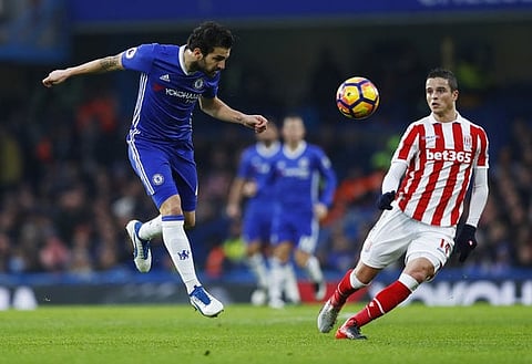 Britain Football Soccer - Chelsea v Stoke City - Premier League - Stamford Bridge - 31/12/16 Chelsea's Cesc Fabregas in action with Stoke City's Ibrahim Affelay Reuters / Eddie Keogh Livepic EDITORIAL USE ONLY. No use with unauthorized audio, video, data, fixture lists, club/league logos or "live" services. Online in-match use limited to 45 images, no video emulation. No use in betting, games or single club/league/player publications. Please contact your account representative for further details.