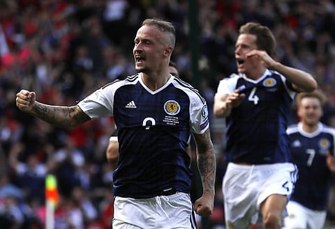 Leigh Griffiths celebrates scoring against England