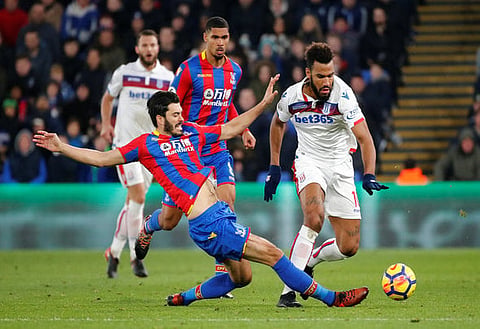 Soccer Football - Premier League - Crystal Palace vs Stoke City - Selhurst Park, London, Britain - November 25, 2017 Crystal Palace's James Tomkins in action with Stoke City's Eric Maxim Choupo-Moting REUTERS/Tolga Akmen EDITORIAL USE ONLY. No use with unauthorized audio, video, data, fixture lists, club/league logos or "live" services. Online in-match use limited to 75 images, no video emulation. No use in betting, games or single club/league/player publications. Please contact your account representative for further details.?