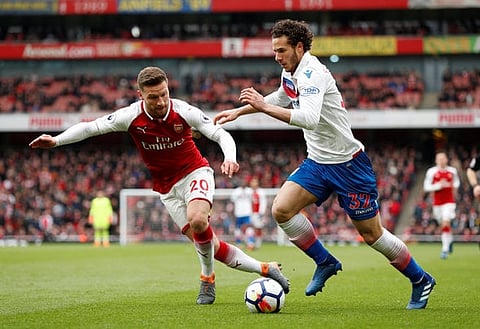 Soccer Football - Premier League - Arsenal vs Stoke City - Emirates Stadium, London, Britain - April 1, 2018 Stoke City's Ramadan Sobhi in action with Arsenal's Shkodran Mustafi Action Images via Reuters/John Sibley EDITORIAL USE ONLY. No use with unauthorized audio, video, data, fixture lists, club/league logos or "live" services. Online in-match use limited to 75 images, no video emulation. No use in betting, games or single club/league/player publications. Please contact your account representative for further details.