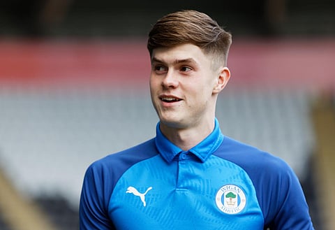 Sources: Wigan defender Pearce agrees new contract
