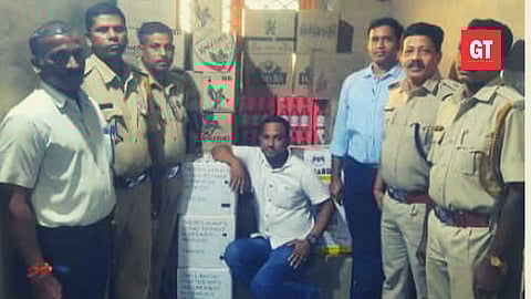 Superintendent Chandranath Dessai along with the team and the seized alcohol