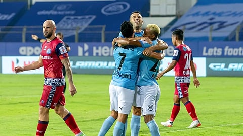 Bipin Singh, Cassio Gabriel and Igor Angulo celebrate after scoring against Jamshedpur FC.