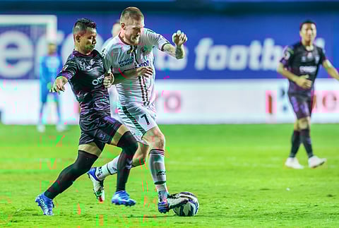 Redeem Tlang of Odisha FC (L) and Joni Kauko of ATK Mohun Bagan vie for ball, during match 100 of season 8 of Indian Super League football tournament between Odisha FC and ATK Mohun Bagan