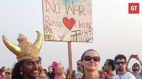 A man seen holding a poster that read 'No war' 