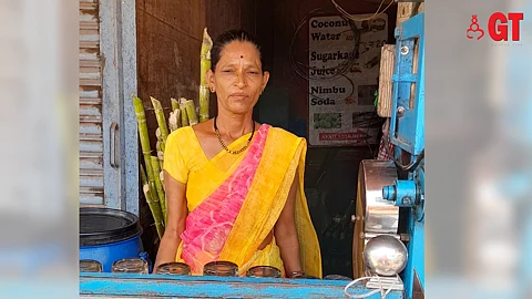 Rita Jamdar at her cubicle, waiting on her customers.