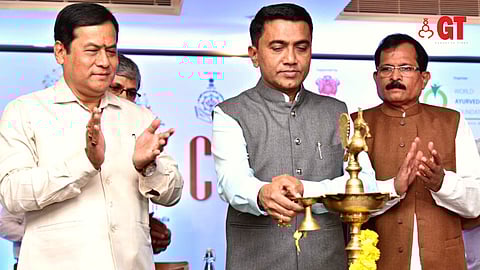 CM Pramod Sawant lighting the lamp during the inauguration of the curtain-raiser of the 9th World Ayurveda Congress & Arogya Expo, flanked by Sarbananda Sonowal  (left) and Shripad Yesso Naik (right).