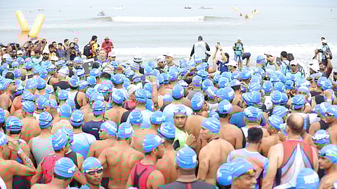 Triathletes raring to take the plunge in the sea for the swimming challenge at the Ironman 70.3 Goa in 2019.
