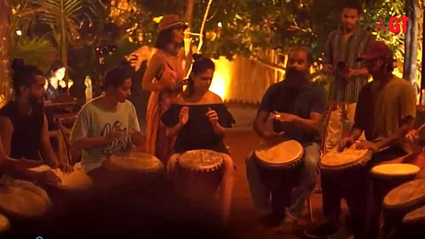 Join a drum circle at Totem, Mandrem