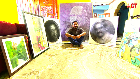 Pradul Sanguekar surrounded by his artwork.