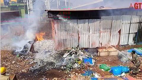 Fire fighters, Jawans trying to extinguish fire at garbage shed near Hansa gate.