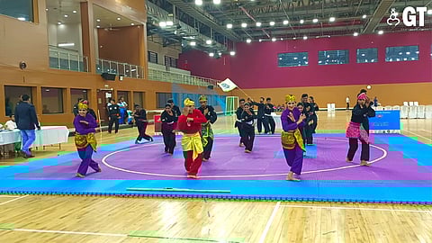 Pencak Silat team demonstrating Silat form before delegates.