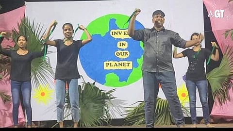 Youngsters seen performing a dance on the occasion of World Earth Day