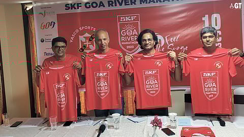 (Left to right) Rakesh Unny, Manish Bhatnagar, Nitin Bandekar and Abhijeet Salkar unveiling the SKF Goa river marathon 2023 T-shirt.