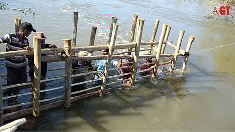 'Bundh' being repaired using traditional methods.