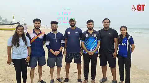 Coach Sandeep Shetkar and team after an early morning training session on Benaulim Beach.
