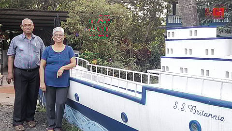 Antonio D'Souza with wife Sheela in front of a replica of S S Britannia built in memory of his father Albino.