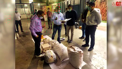 Drugs being counterchecked before being disposed.