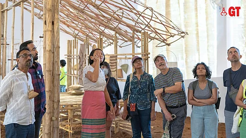Sandeep Sangaru (far left), curator of the exhibit ‘Bamboo: A Way of Life - Curated Walkthrough’ guides visitors around the exhibit at the ongoing Serendipity Arts Festival 2023.