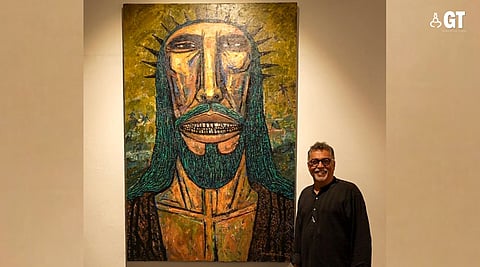 Artist Dr Subodh Kerkar poses next to his artwork, titled ‘The Fisher of Men’, at the ‘Goa’ section of the ‘Maresia’ exhibition -- currently showing at the Museum of Goa (MOG), Pilerne.